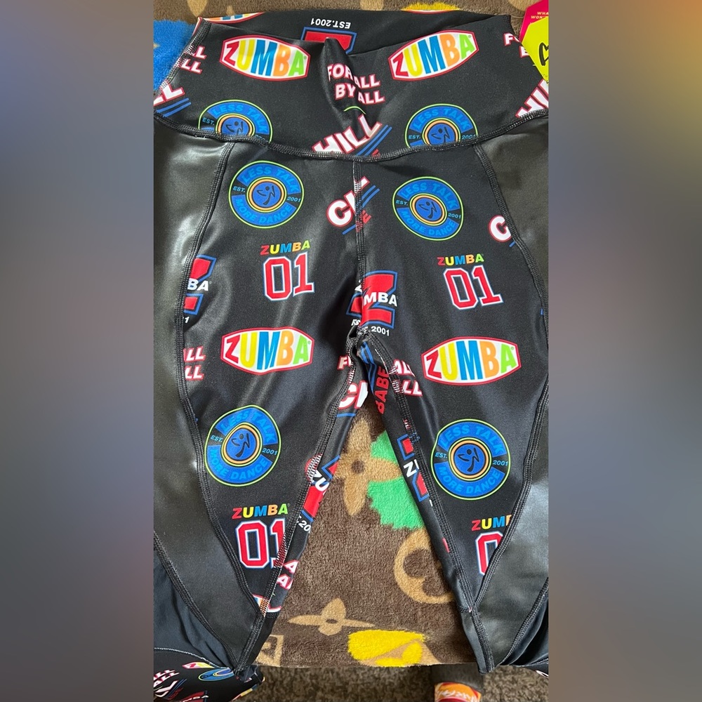 Zumba legging. Brand new with tags. Size medium. Nice prints over black.